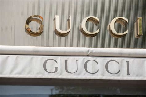 who bought gucci in 1990|current owner of Gucci.